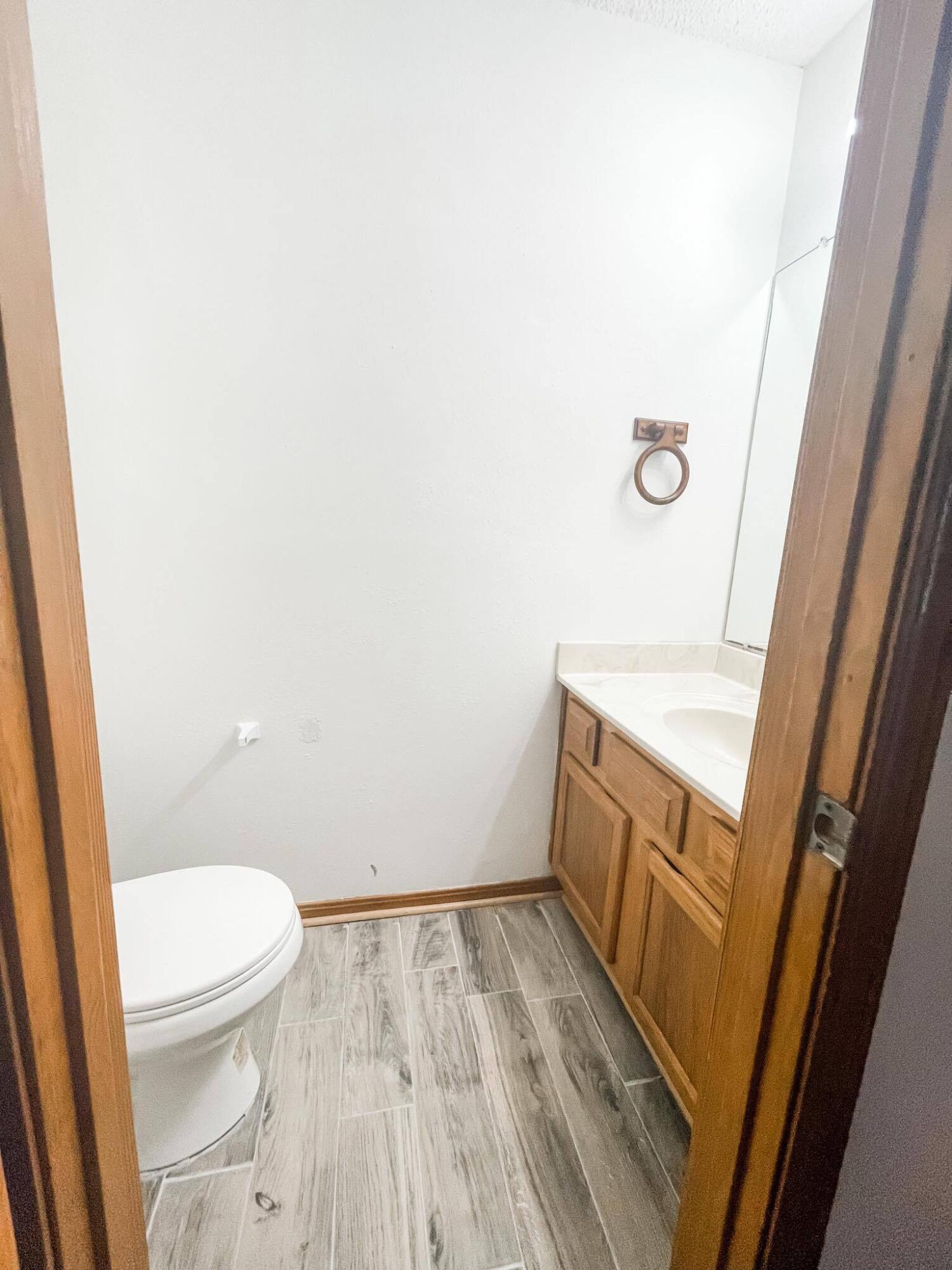888 Culp Avenue, Unit 3 Fort Walton Beach, FL 32547 - Photo 5 of 12 a bathroom with a sink and toilet