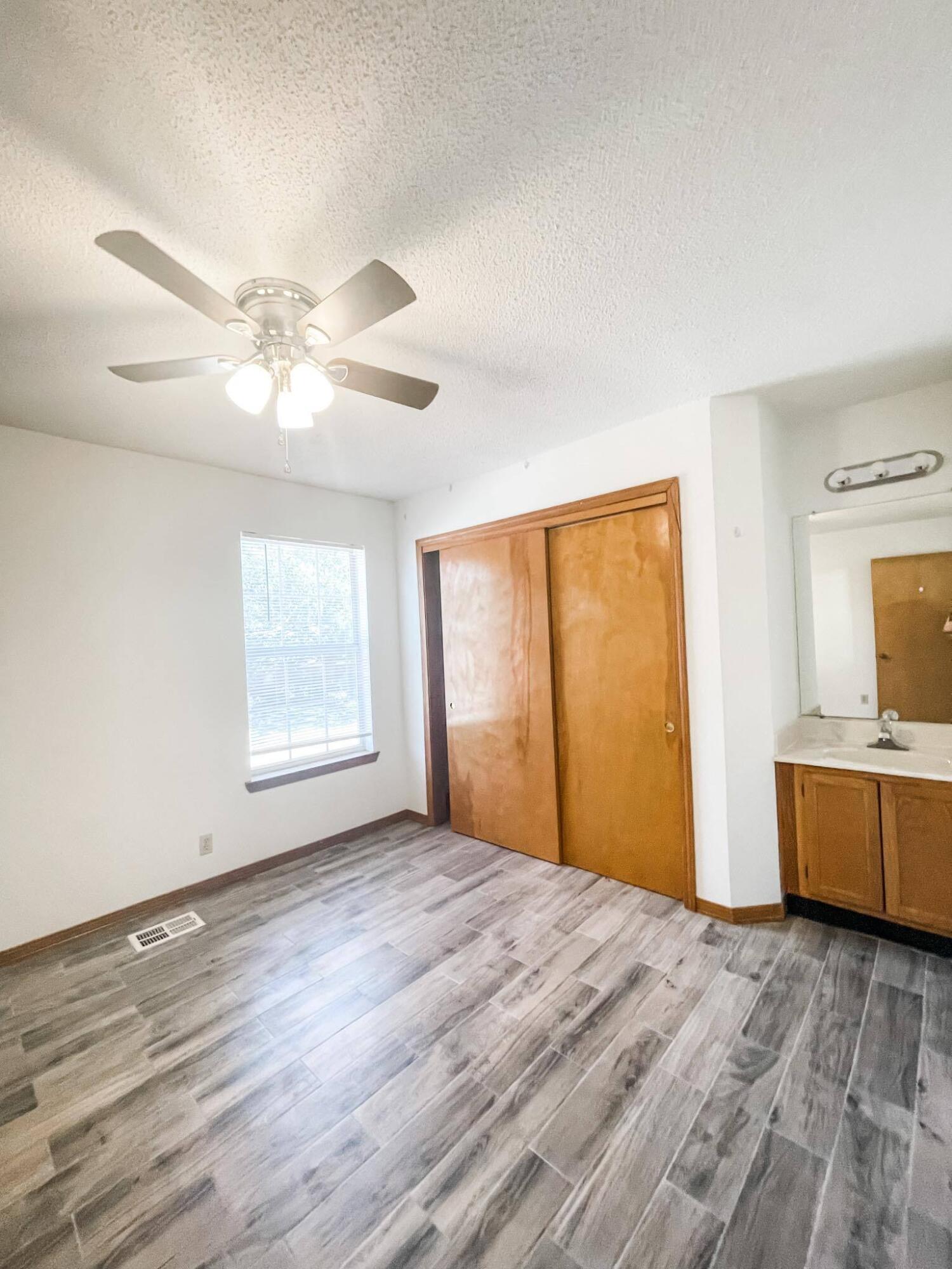 888 Culp Avenue, Unit 3 Fort Walton Beach, FL 32547 - Photo 8 of 12 a view of an empty room with a window