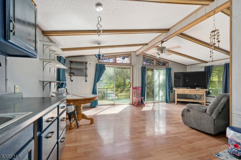 126 Armstrong Road Montague, NJ 07827 - Photo 11 of 28 a living room with furniture and a flat screen tv