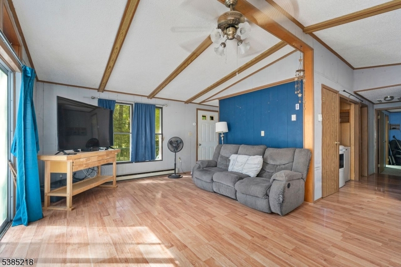 126 Armstrong Road Montague, NJ 07827 - Photo 12 of 28 a living room with furniture and a flat screen tv