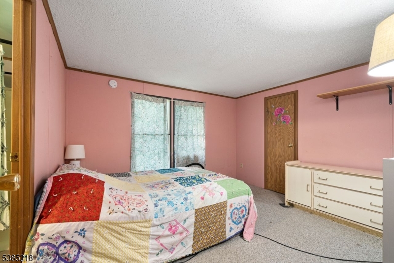 126 Armstrong Road Montague, NJ 07827 - Photo 14 of 28 a bedroom with a bed and a window
