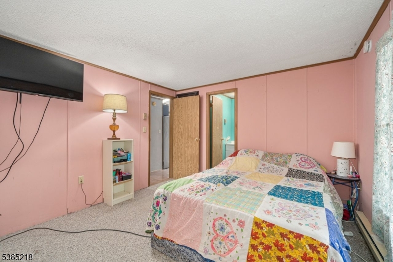 126 Armstrong Road Montague, NJ 07827 - Photo 15 of 28 a bedroom with a bed and a dresser