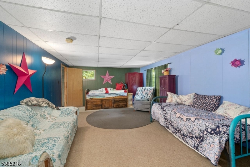 126 Armstrong Road Montague, NJ 07827 - Photo 22 of 28 a living room with furniture and a rug