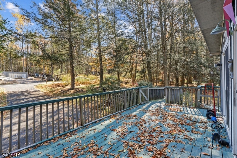 126 Armstrong Road Montague, NJ 07827 - Photo 23 of 28 a balcony with trees in front of it