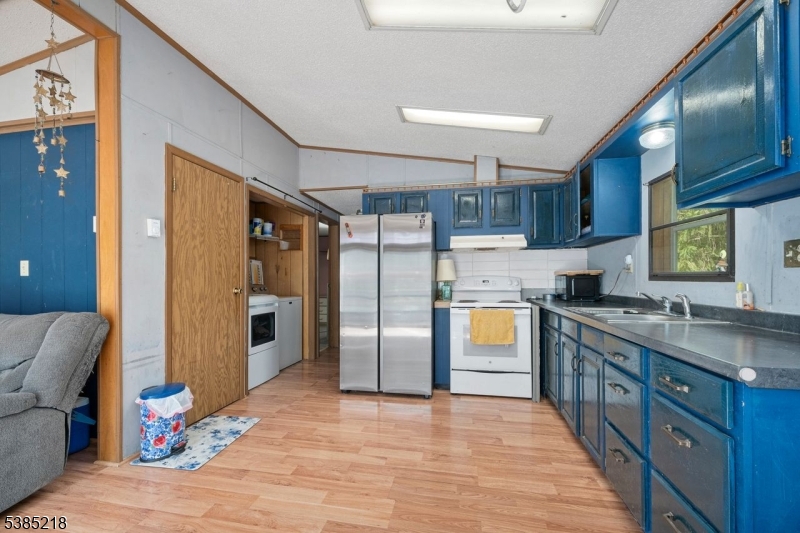 126 Armstrong Road Montague, NJ 07827 - Photo 10 of 28 a kitchen with stainless steel appliances granite countertop a refrigerator and a stove top oven