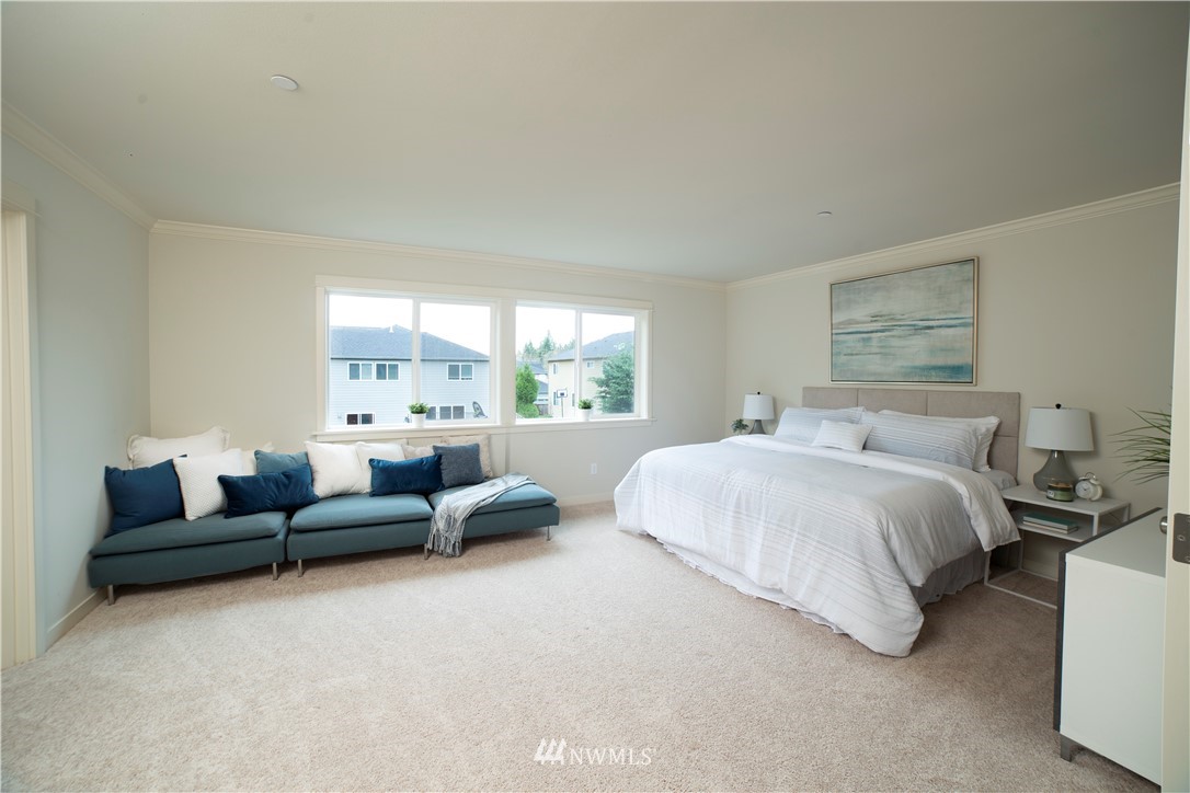 22206 32nd Avenue Southeast Bothell, WA 98021 - Photo 14 of 26 a bedroom with bed couch and window
