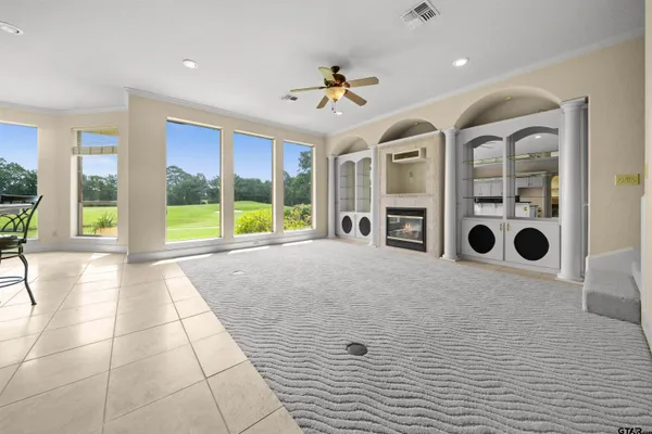 a spacious bathroom with a granite countertop tub sink and mirror