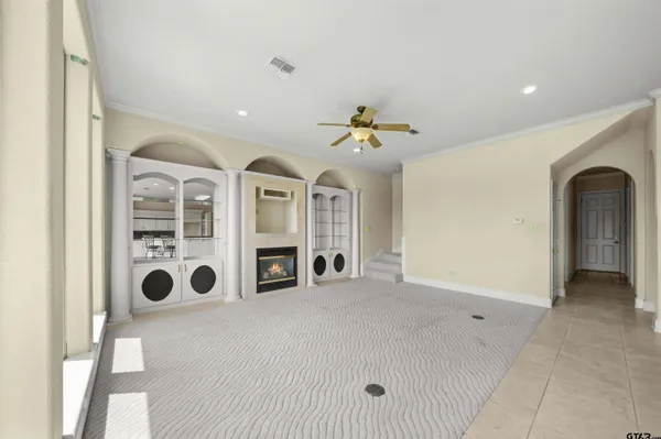 a large spacious bathroom with a tub shower and sink