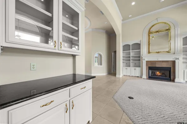 a kitchen with stainless steel appliances granite countertop a sink a stove top oven a counter space and cabinets