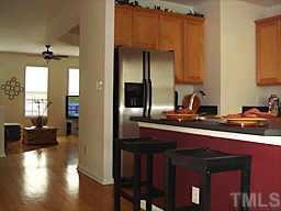 7204 Doverton Court Raleigh, NC 27615 - Photo 1 of 10 a kitchen with a sink and a refrigerator