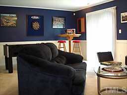 7204 Doverton Court Raleigh, NC 27615 - Photo 10 of 10 a living room with furniture and a window