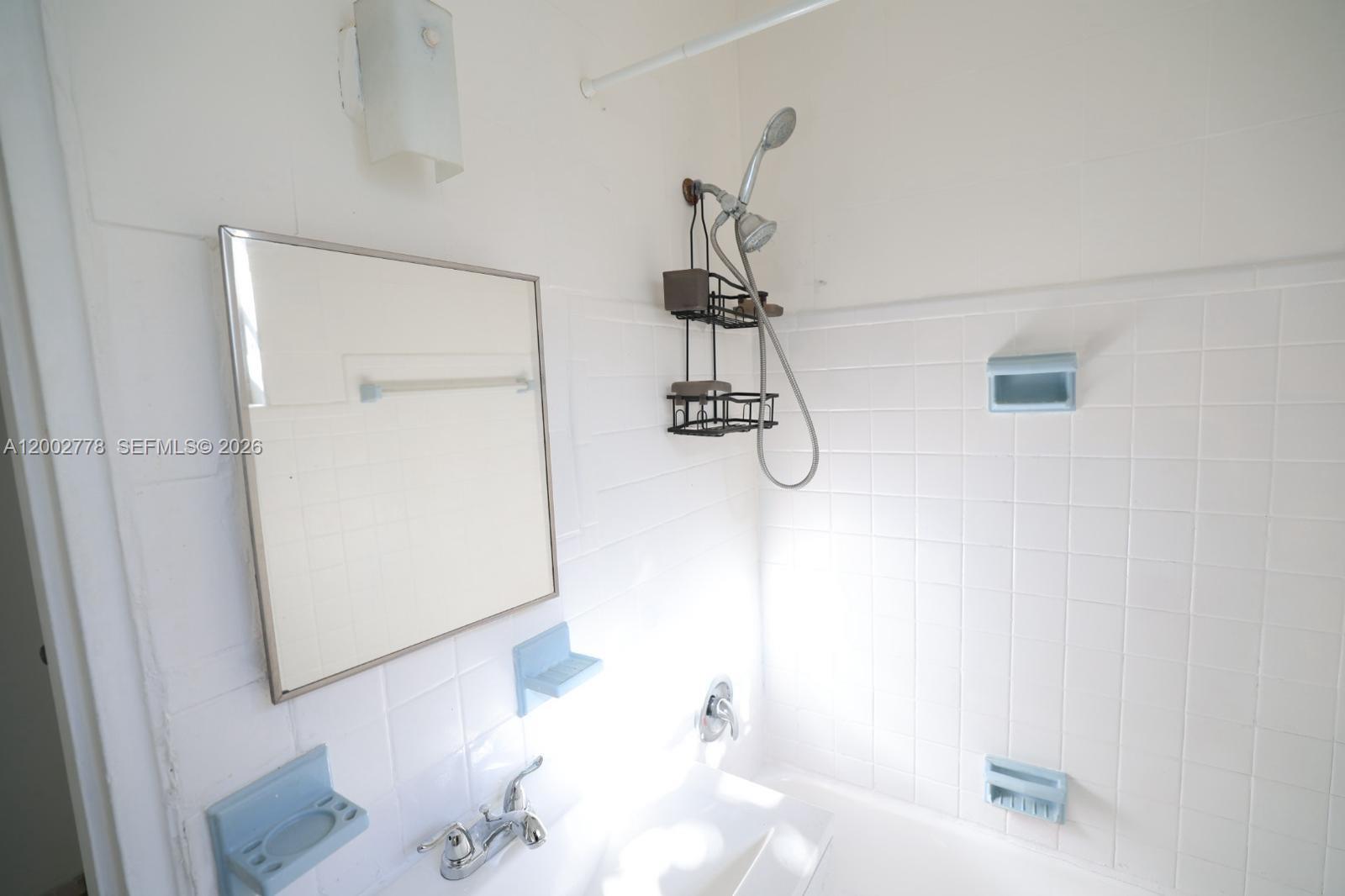 770 83rd Street, Unit 3 Miami Beach, FL 33141 - Photo 6 of 7 a bathroom with a bathtub and shower