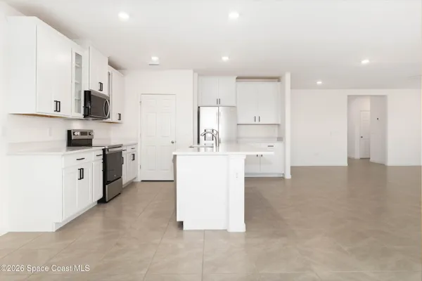 a bathroom with a double vanity sink a mirror and a shower