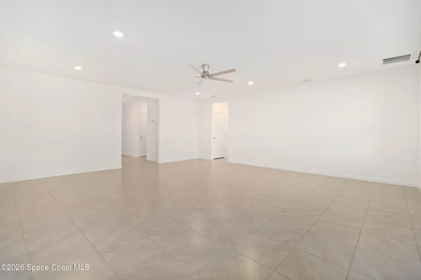 a bathroom with a granite countertop sink mirror toilet and bathtub