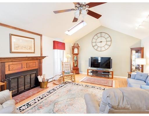 1 Long Boat Road Bourne, MA 02532 - Photo 11 of 29 a living room with furniture a flat screen tv and a large window