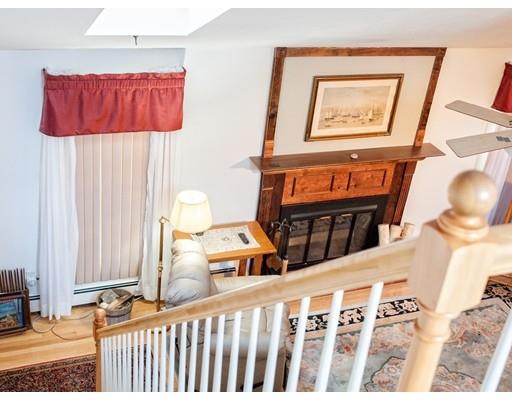 1 Long Boat Road Bourne, MA 02532 - Photo 12 of 29 a bedroom with a bed and a painting on the wall