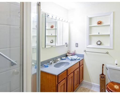 1 Long Boat Road Bourne, MA 02532 - Photo 15 of 29 a bathroom with a sink a toilet and shower curtain