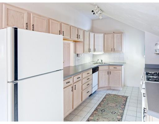 1 Long Boat Road Bourne, MA 02532 - Photo 23 of 29 a kitchen with stainless steel appliances a refrigerator sink and cabinets