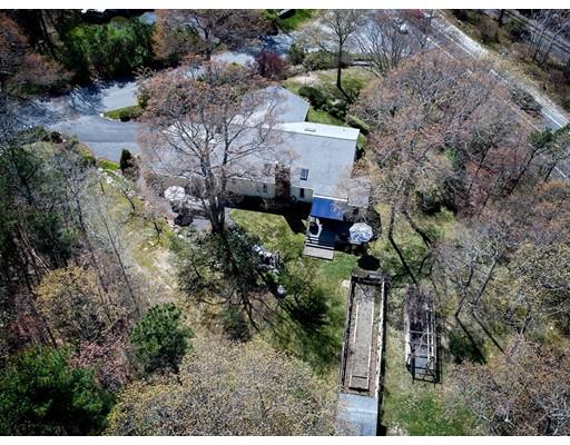 1 Long Boat Road Bourne, MA 02532 - Photo 25 of 29 a aerial view of a house with a yard and plants