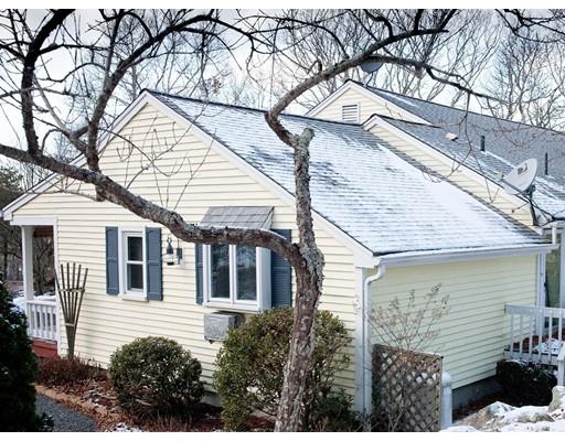 1 Long Boat Road Bourne, MA 02532 - Photo 26 of 29 a front view of a house with a yard and potted plants