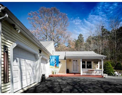 1 Long Boat Road Bourne, MA 02532 - Photo 3 of 29 a front view of a house with a yard