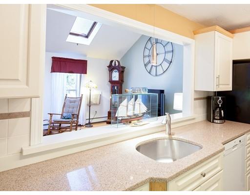 1 Long Boat Road Bourne, MA 02532 - Photo 7 of 29 a very nice looking room with a large mirror and a clock on the wall