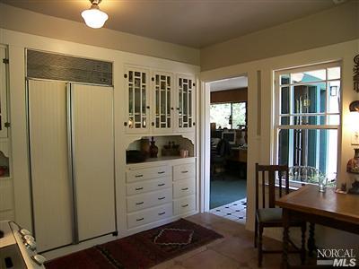 57 Spruce Road Fairfax, CA 94930 - Photo 9 of 12 a view of bedroom with a table and chairs