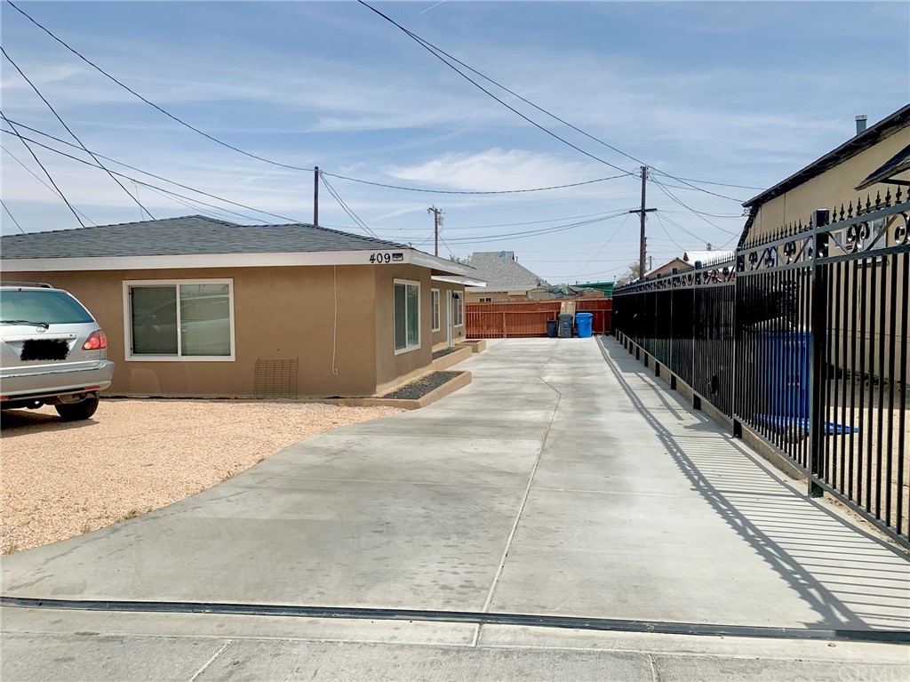 409 North 3rd Avenue Barstow, CA 92311 - Photo 1 of 1 a view of a car park in front of house