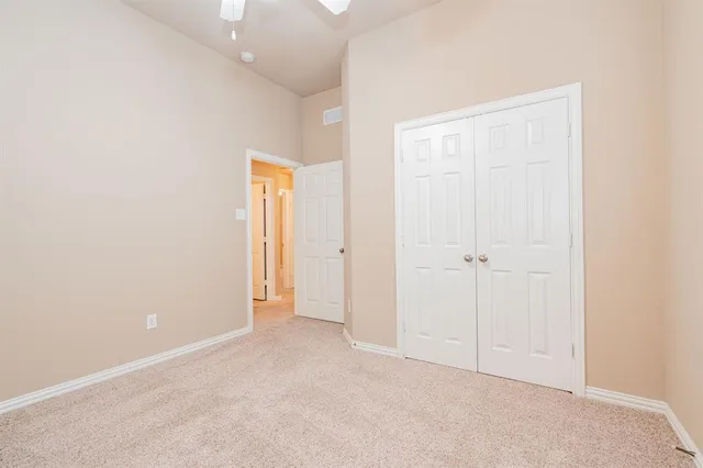 an empty room with closet area
