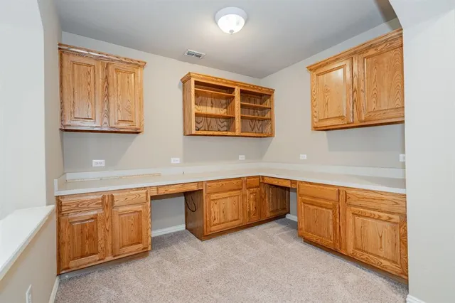 a kitchen with stainless steel appliances granite countertop a sink and cabinets
