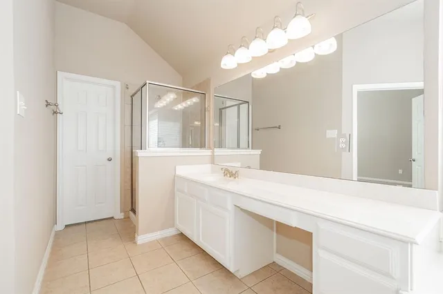 a bathroom with a sink a vanity and a mirror