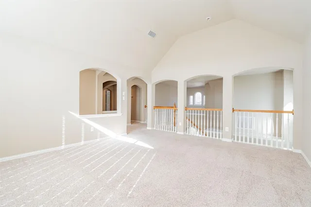 a view of a bedroom with wooden floor