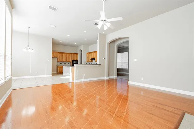 a view of an entryway with wooden floor