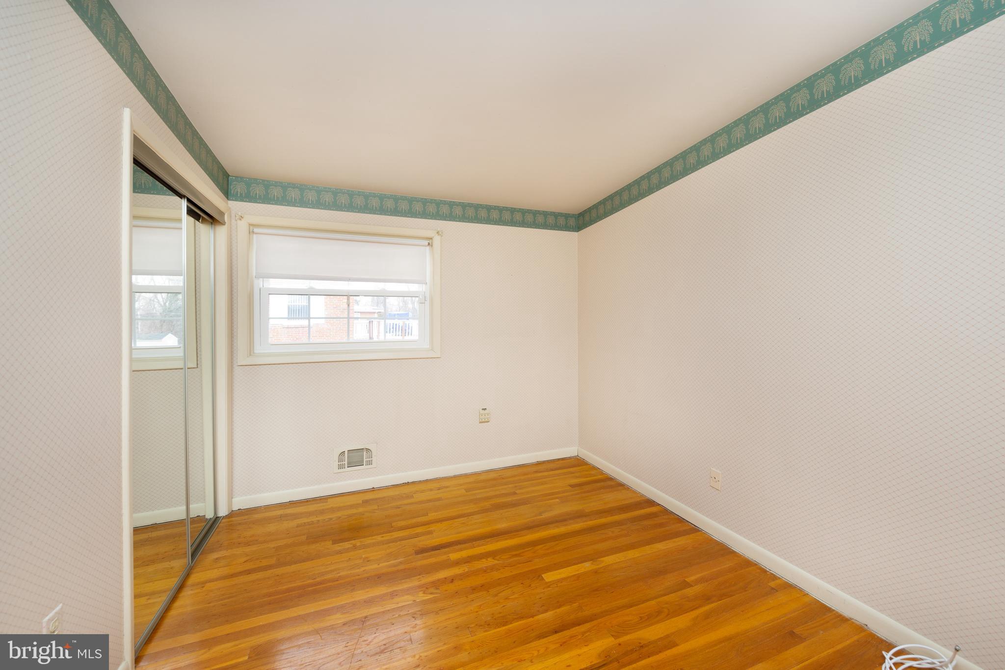 6831 Queens Ferry Road Baltimore, MD 21239 - Photo 14 of 30 Bedroom 3 with Hardwood Flooring