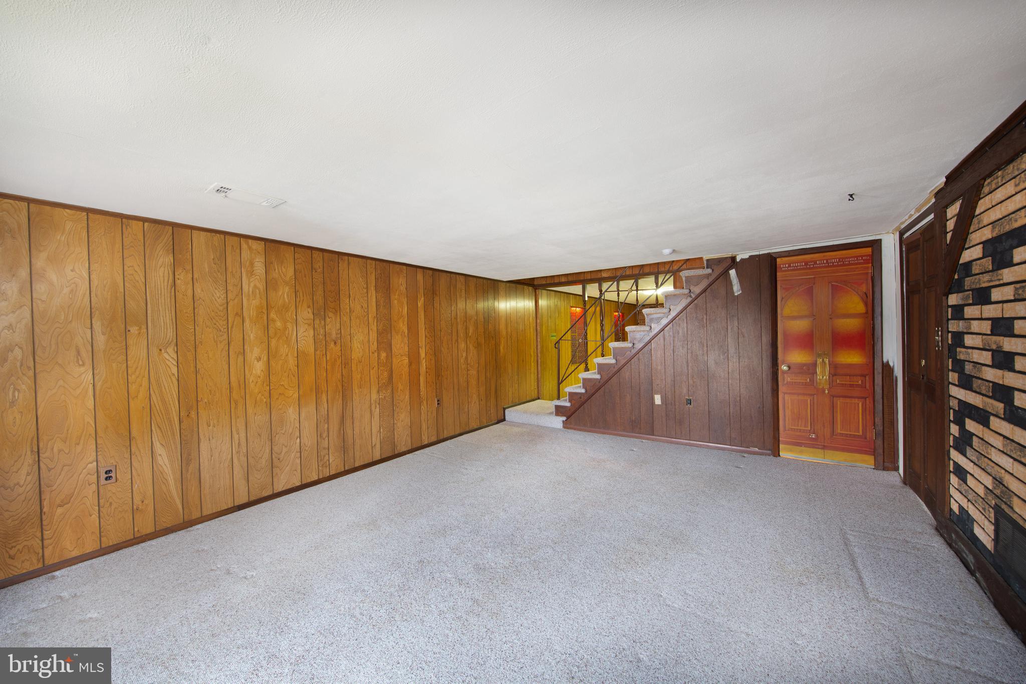 6831 Queens Ferry Road Baltimore, MD 21239 - Photo 19 of 30 Lower Level Recreation Room with Paneling
