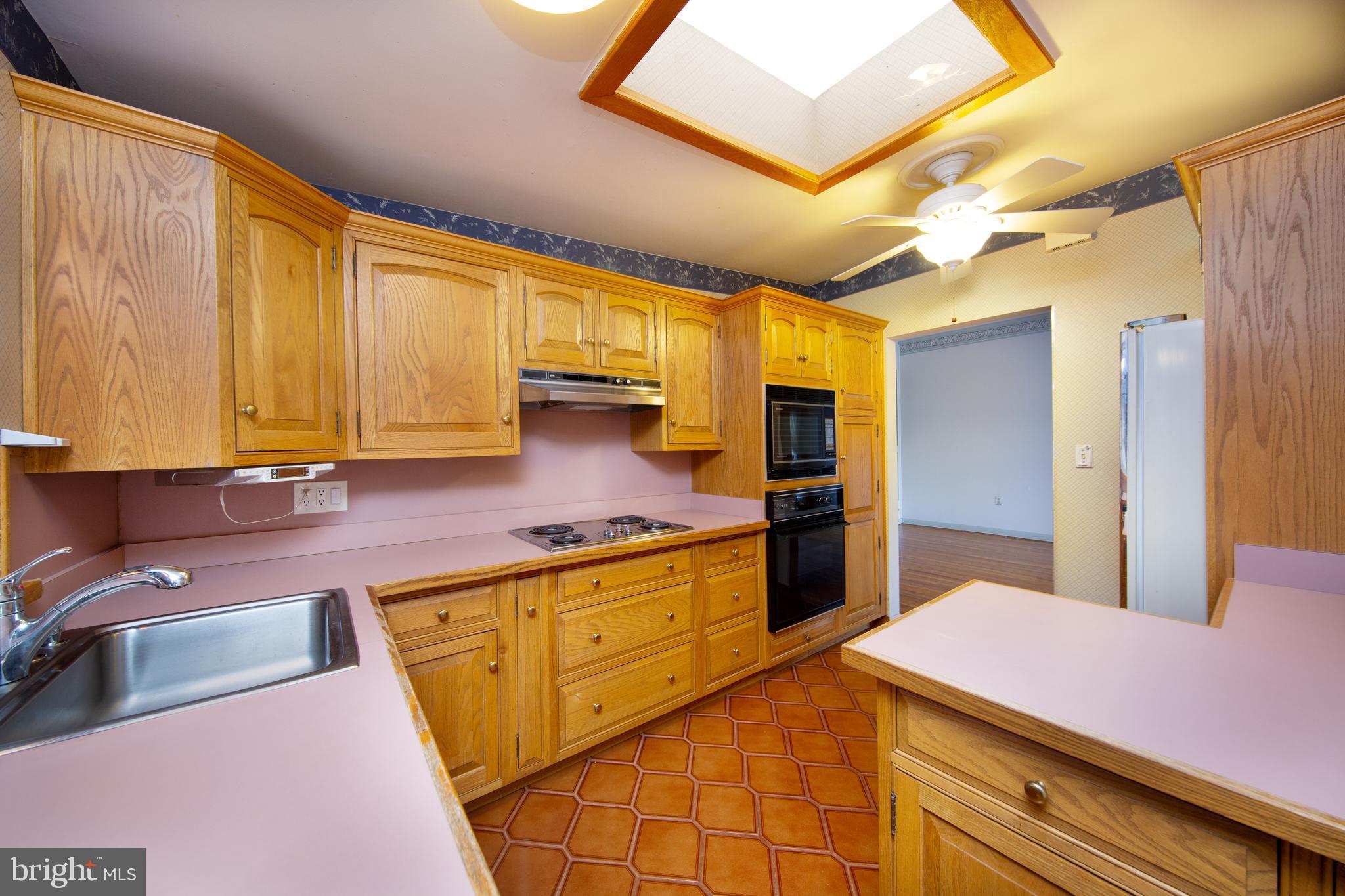 6831 Queens Ferry Road Baltimore, MD 21239 - Photo 5 of 30 Kitchen with Skylight