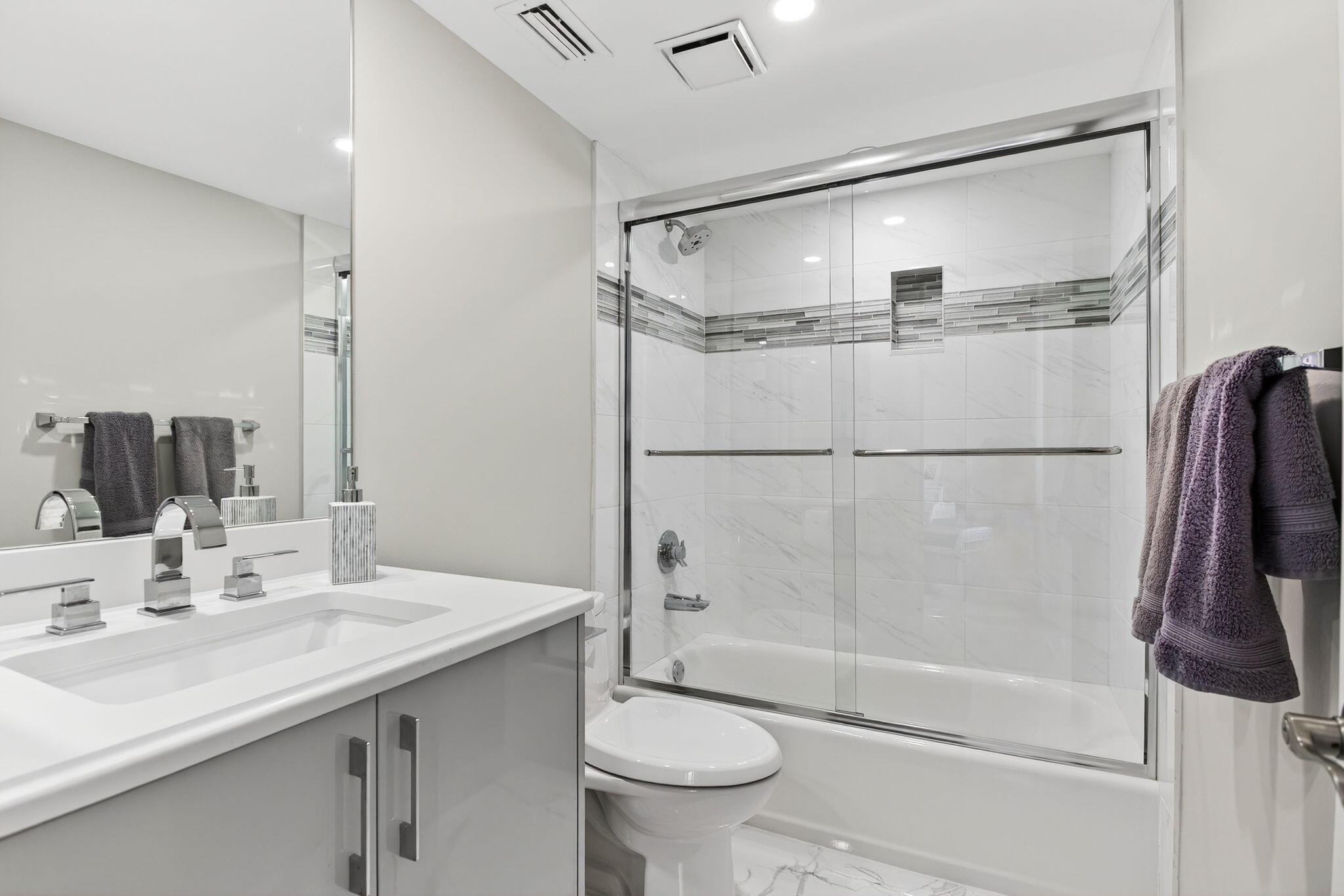 7186 Promenade Drive, Unit 701 Boca Raton, FL 33433 - Photo 33 of 39 a bathroom with a sink toilet and shower