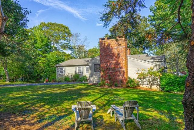 2 Fuller Road Centerville, MA 02632 - Photo 3 of 26 a backyard of a house with table and chairs