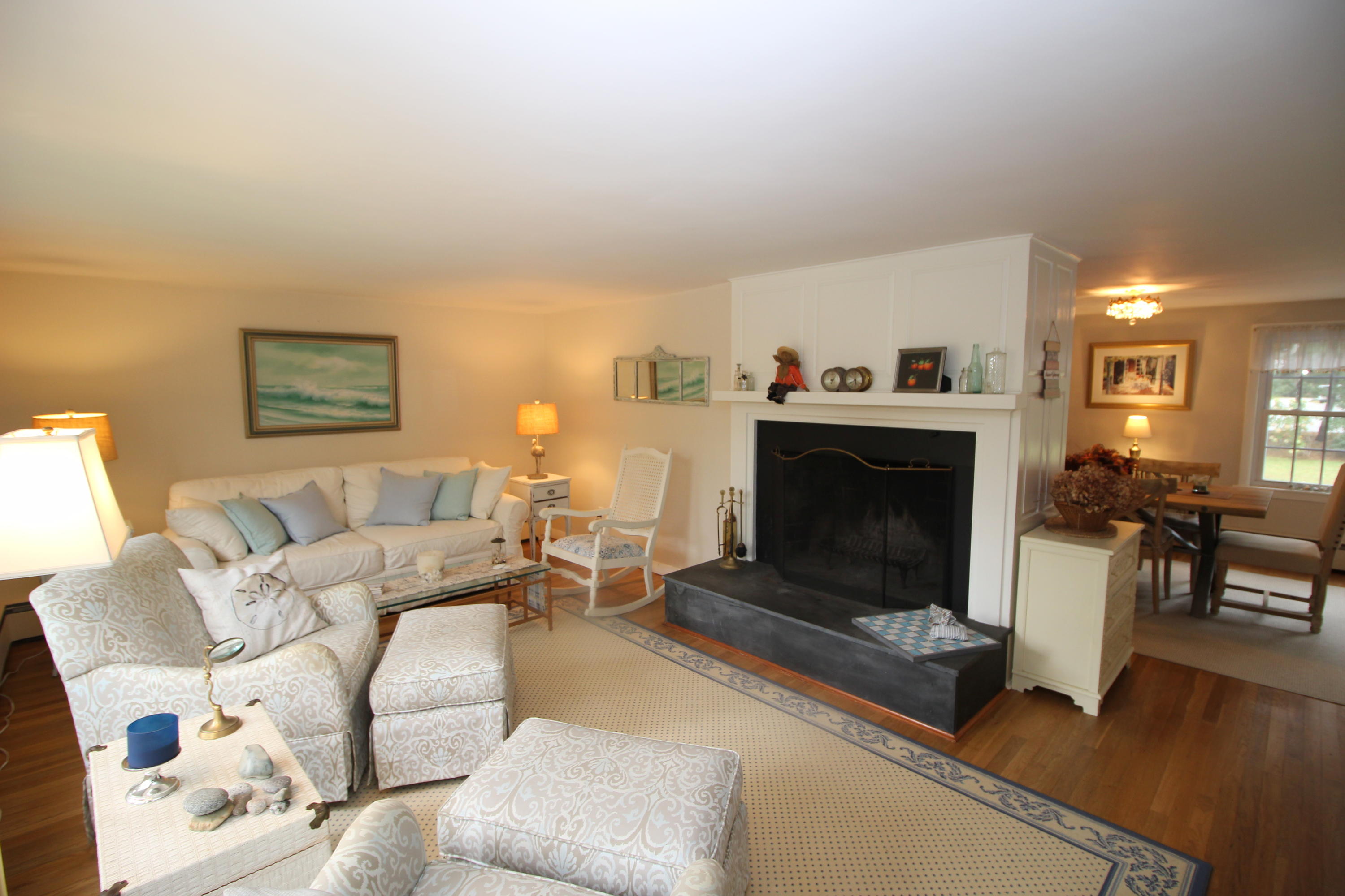 2 Fuller Road Centerville, MA 02632 - Photo 6 of 26 a living room with furniture a fireplace and a flat screen tv