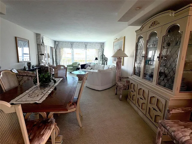 a view of a livingroom with furniture window and wooden floor