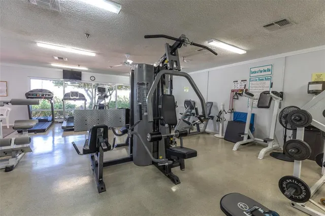 a room with gym equipment and a large window