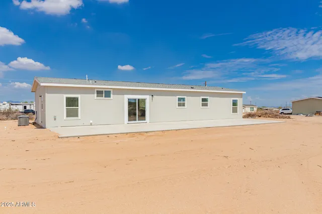 a view of a house with a snow in the background