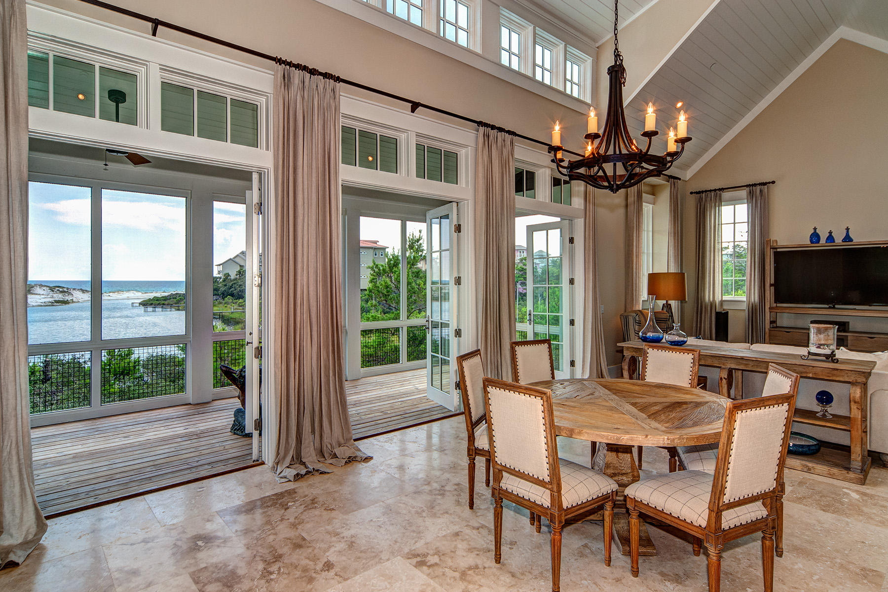 33 Bluff Lane Santa Rosa Beach, FL 32459 - Photo 1 of 37 a view of a dining room with furniture a chandelier and large window