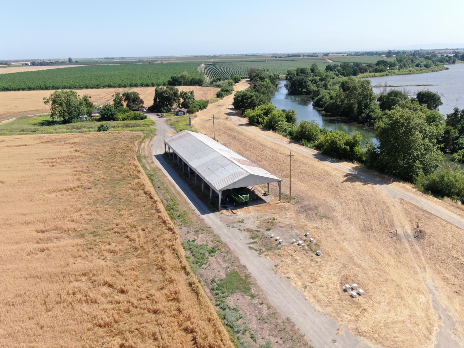 28725 North Vail Road Walnut Grove, CA 95690 - Photo 6 of 7 an aerial view of a house with a yard and lake view