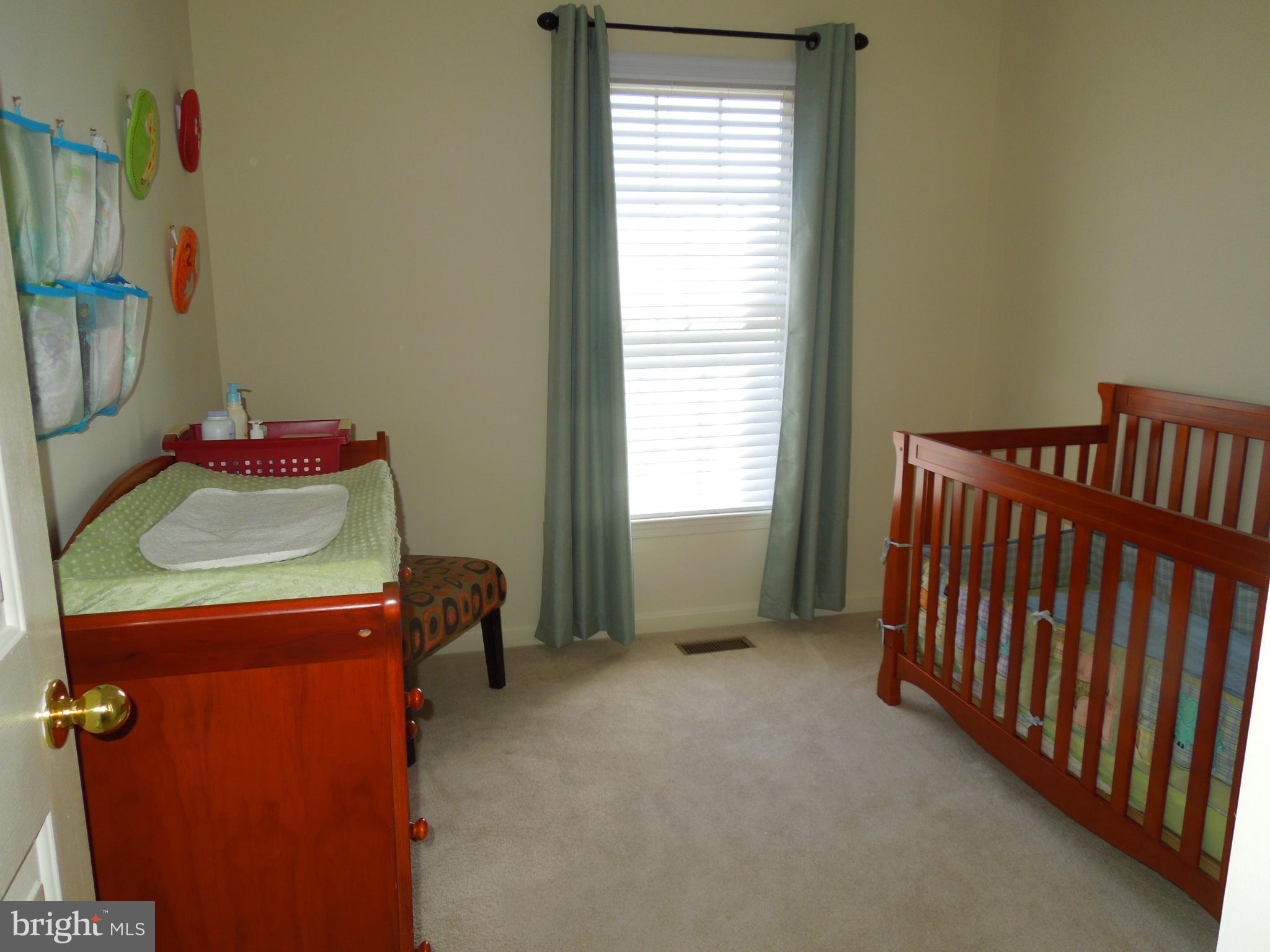 16808 Centerfield Way Olney, MD 20832 - Photo 12 of 22 a room with furniture and a window