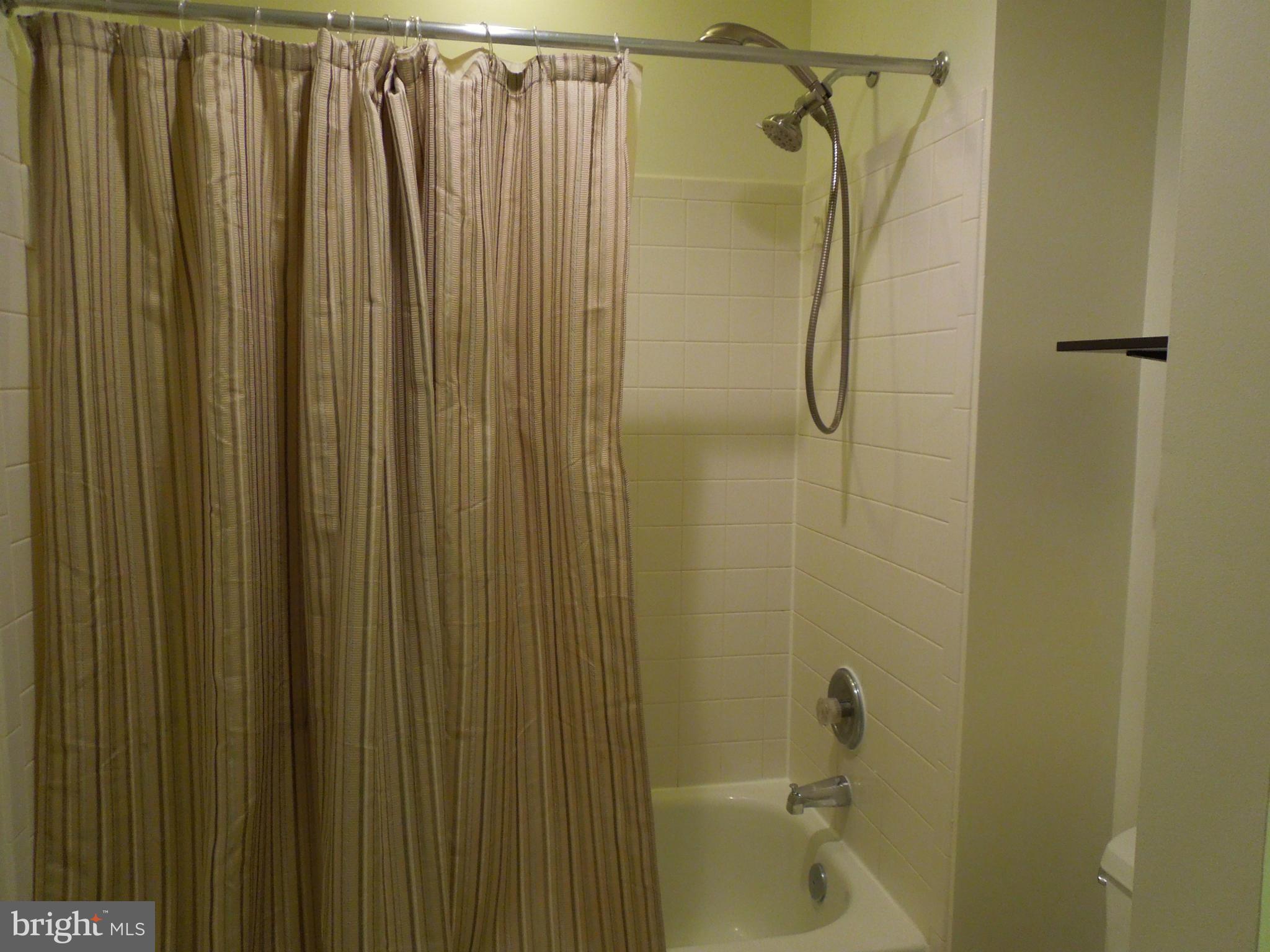 16808 Centerfield Way Olney, MD 20832 - Photo 15 of 22 a bathroom with a shower and a sink