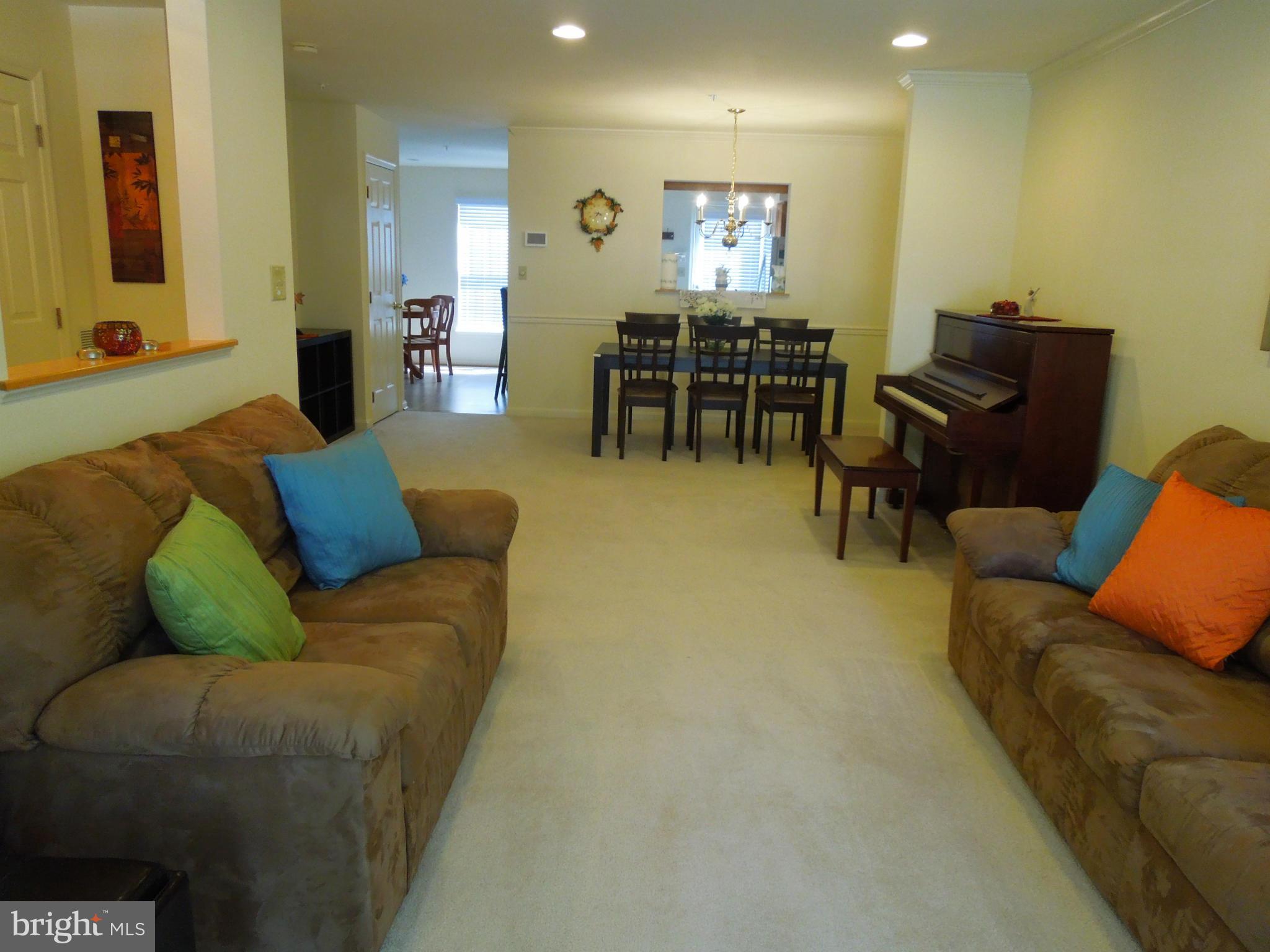 16808 Centerfield Way Olney, MD 20832 - Photo 3 of 22 a living room with furniture and wooden floor