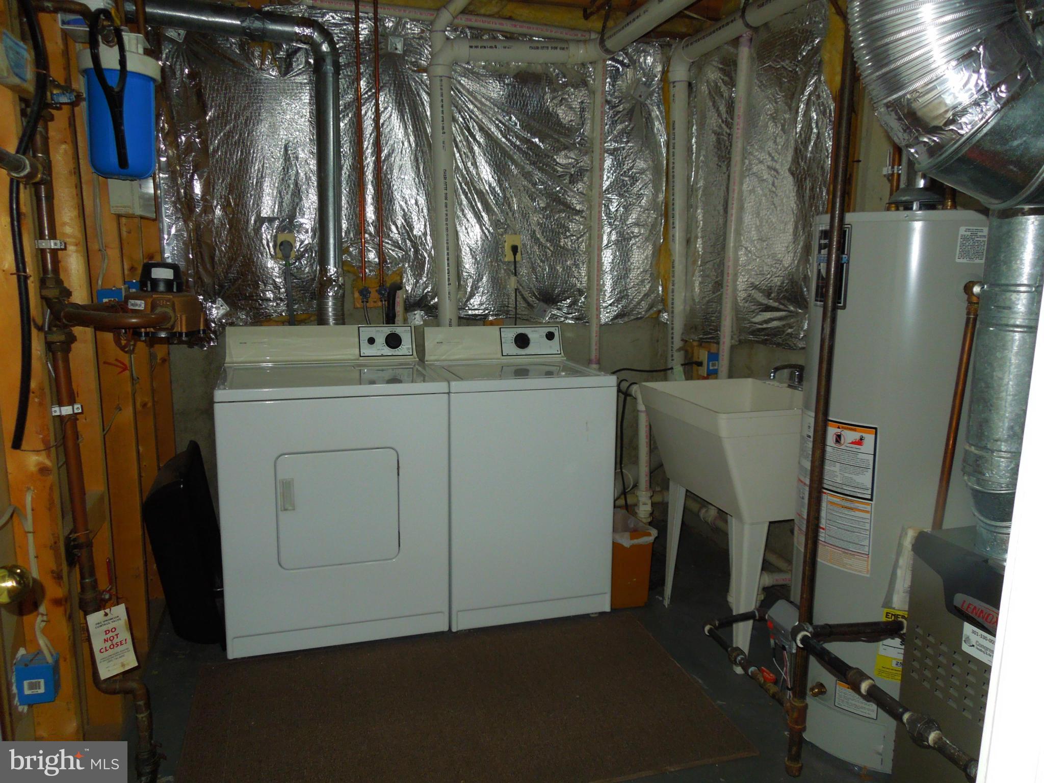 16808 Centerfield Way Olney, MD 20832 - Photo 22 of 22 a view of walk in closet with clothes and shoes