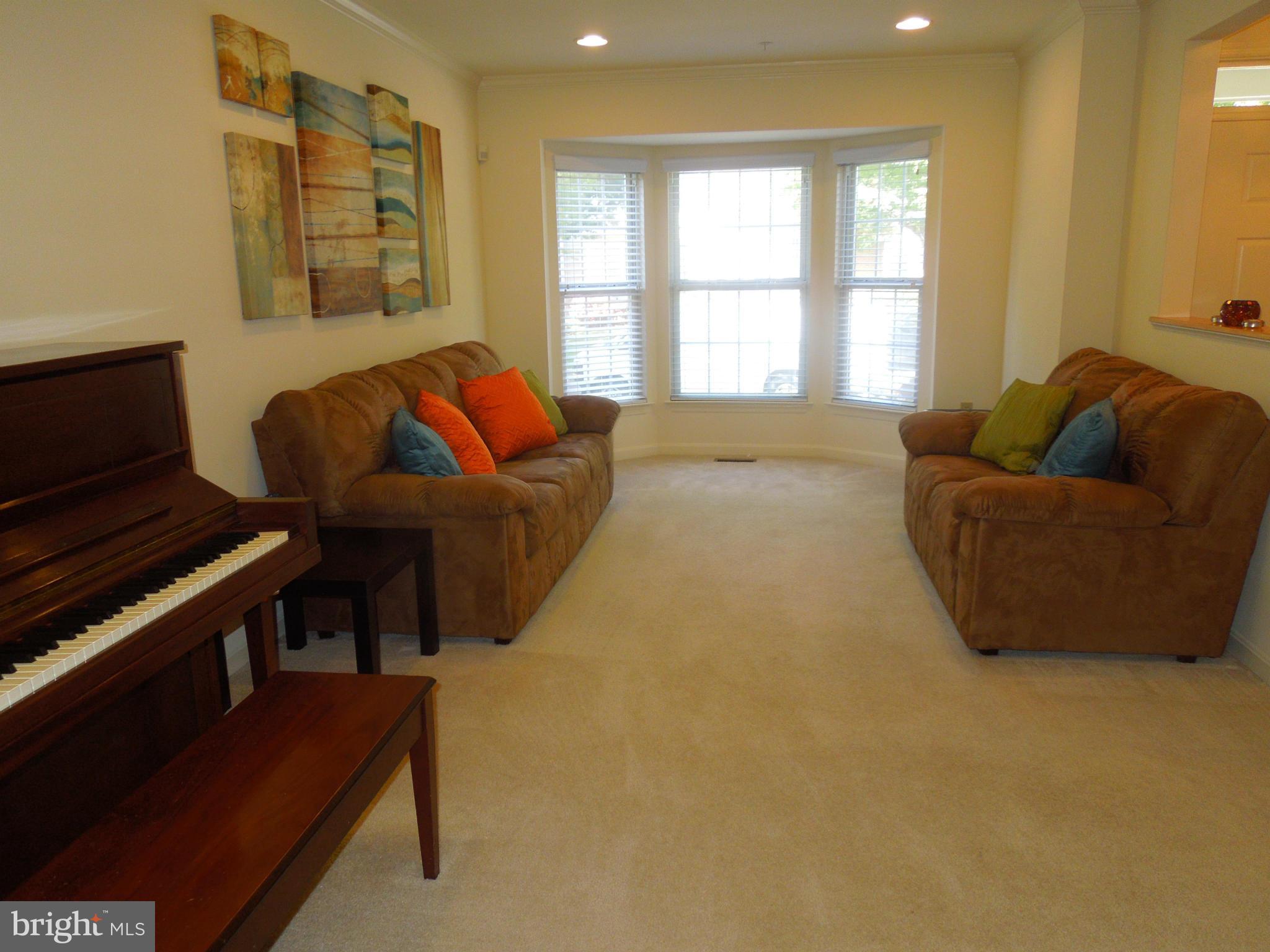 16808 Centerfield Way Olney, MD 20832 - Photo 4 of 22 a living room with furniture and a window