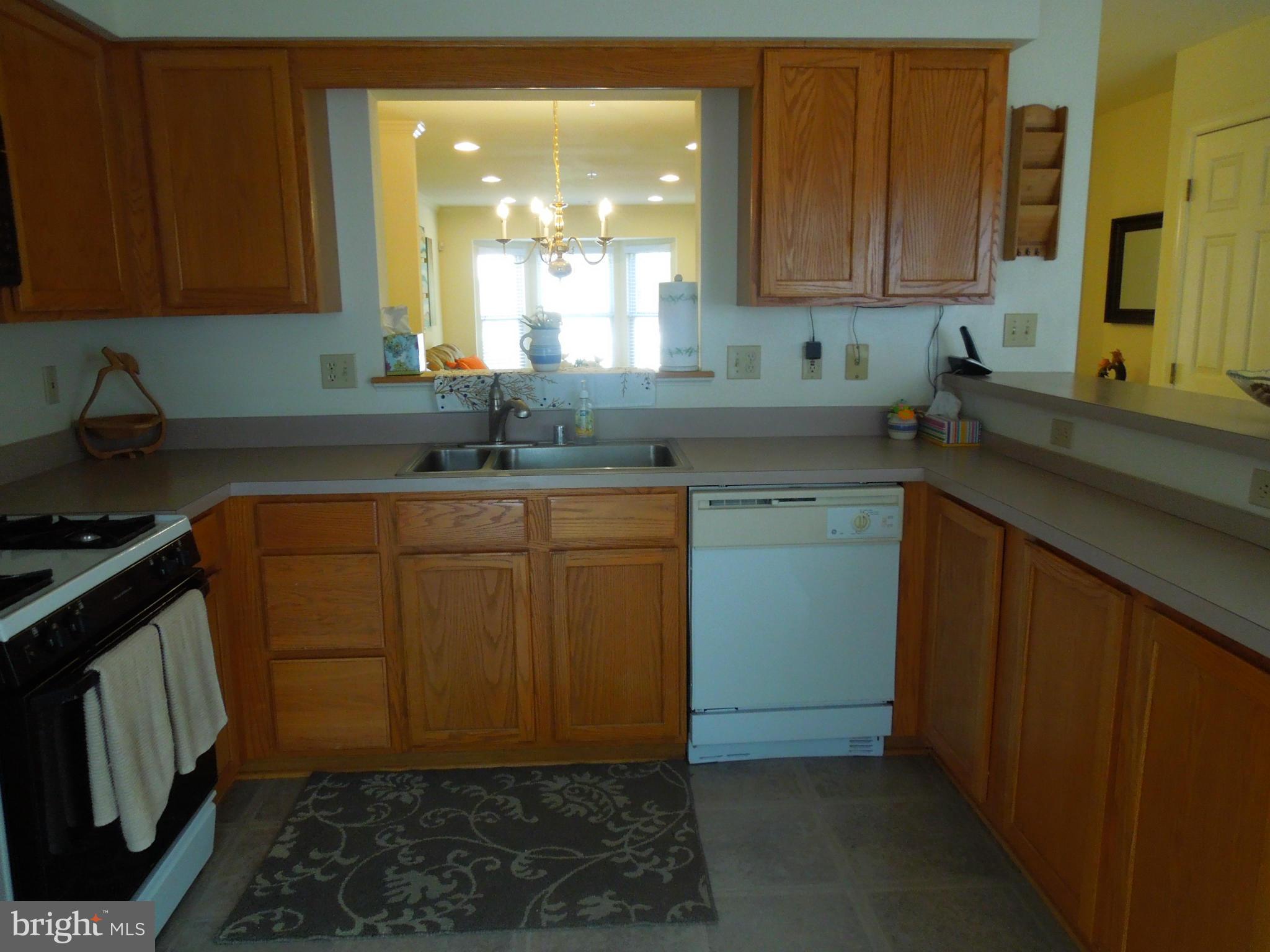 16808 Centerfield Way Olney, MD 20832 - Photo 7 of 22 a kitchen with a sink and cabinets